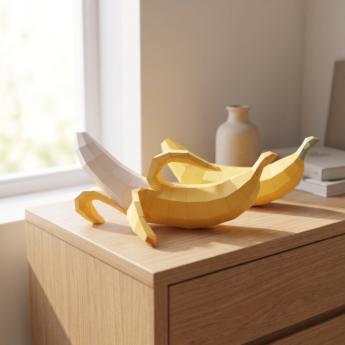 Paper Banana model on a table by the window