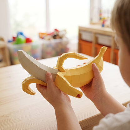 Paper Banana model in a child's hands