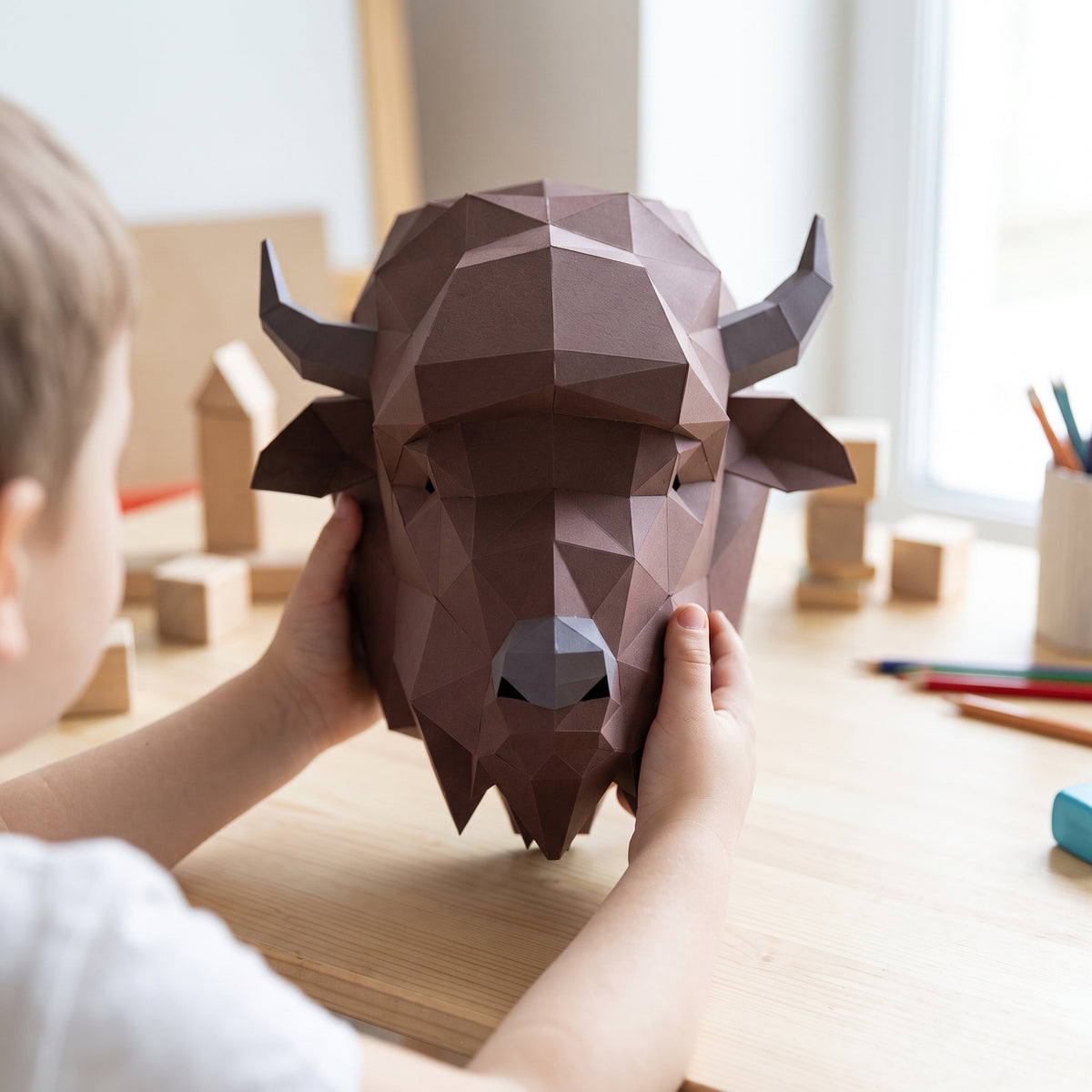 Paper Bison model in a child's hands