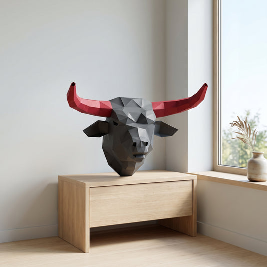 Paper Bull model on a table by the window