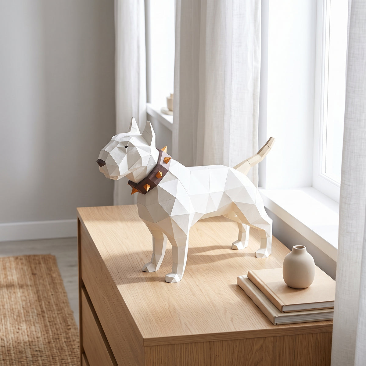 Paper Bullterrier model on a table by the window