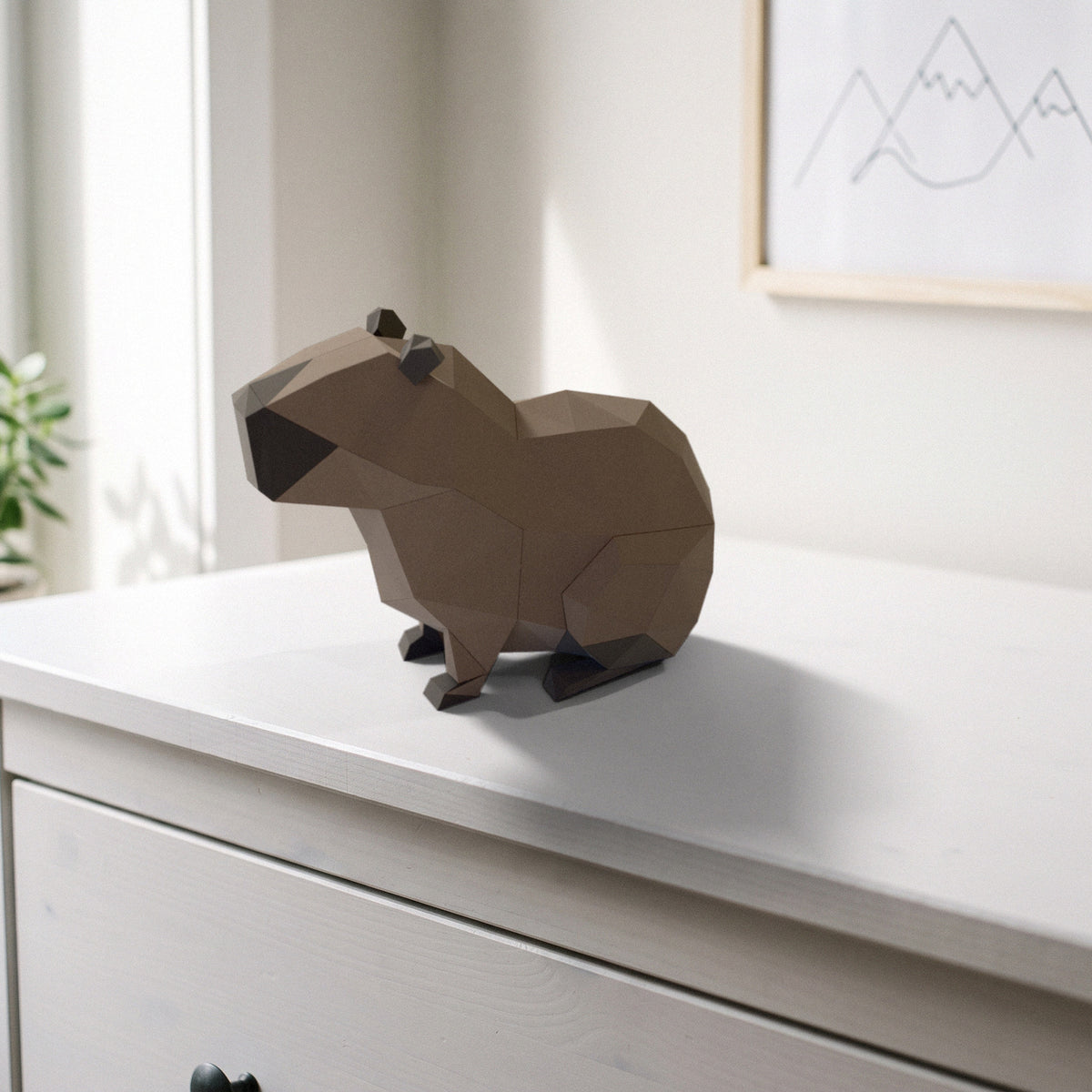 Paper Capybara model on a dresser in a kids' room