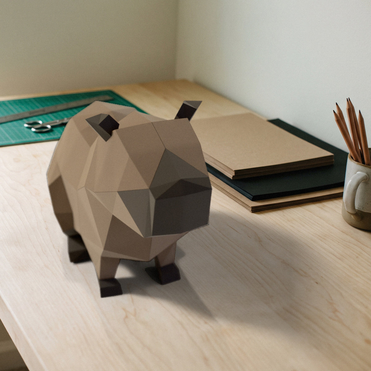 Paper Capybara model on a craft desk