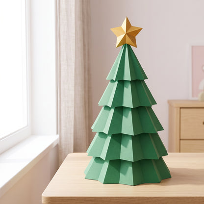 Paper Christmas Tree model on a table by the window