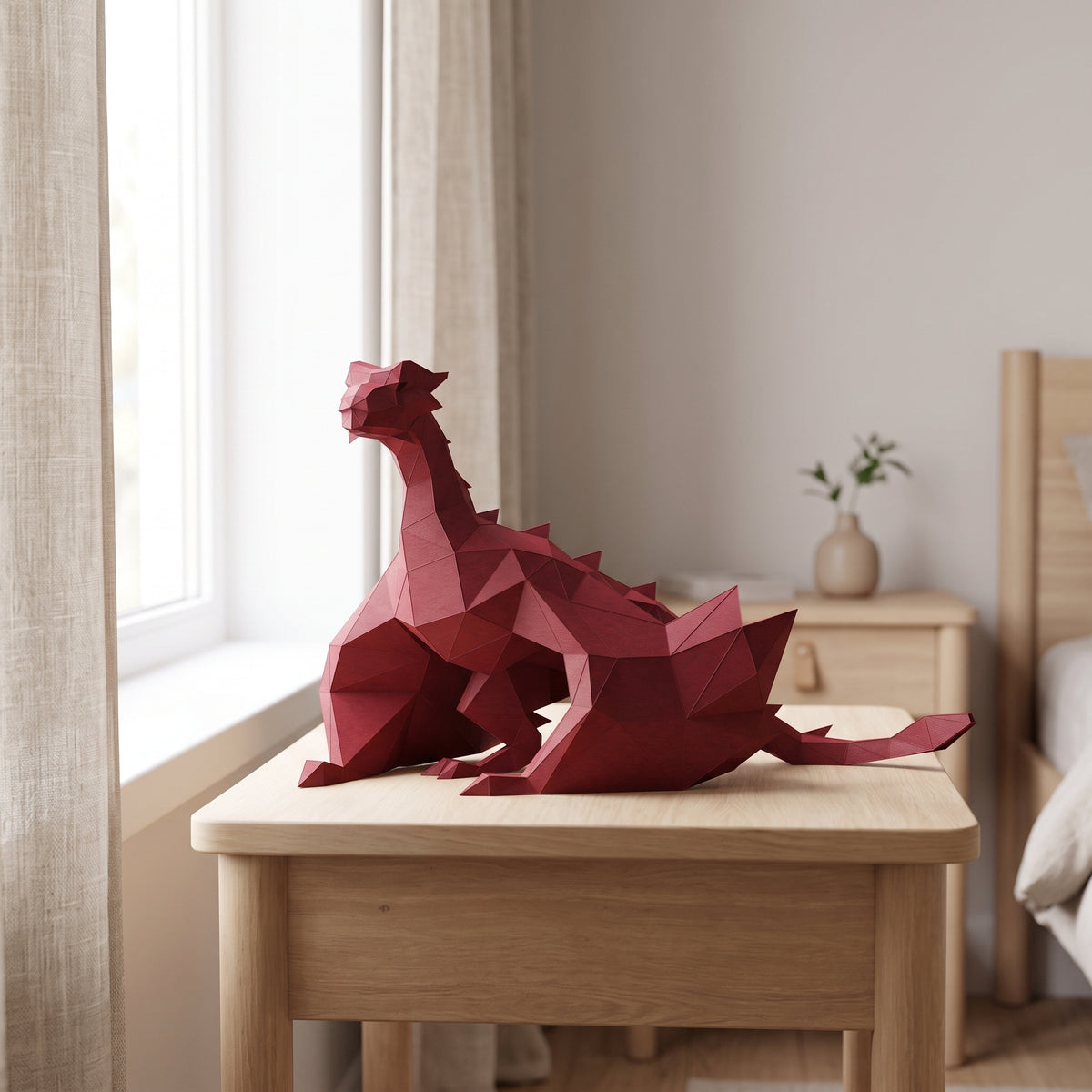 Paper Dragon model on a table by the window