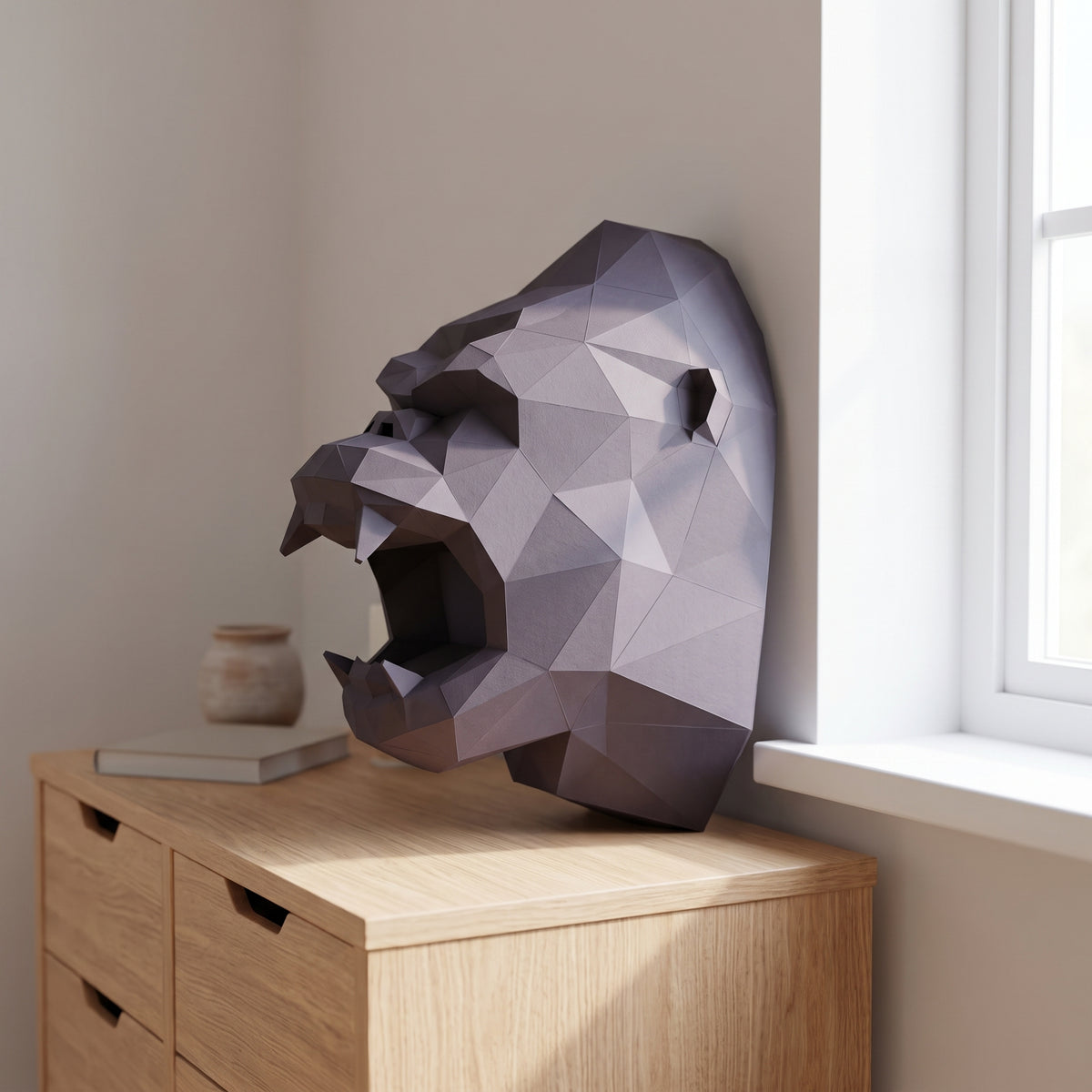 Paper Gorilla model on a table by the window