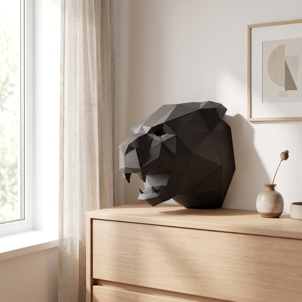 Paper Panther model on a table by the window