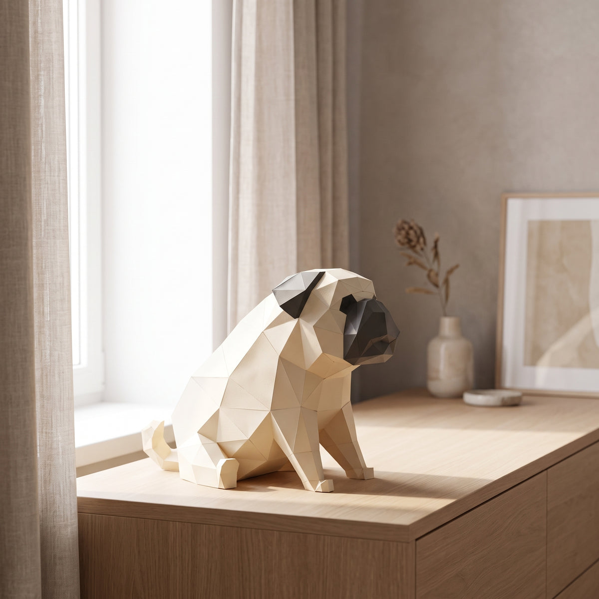 Paper Pug model on a table by the window