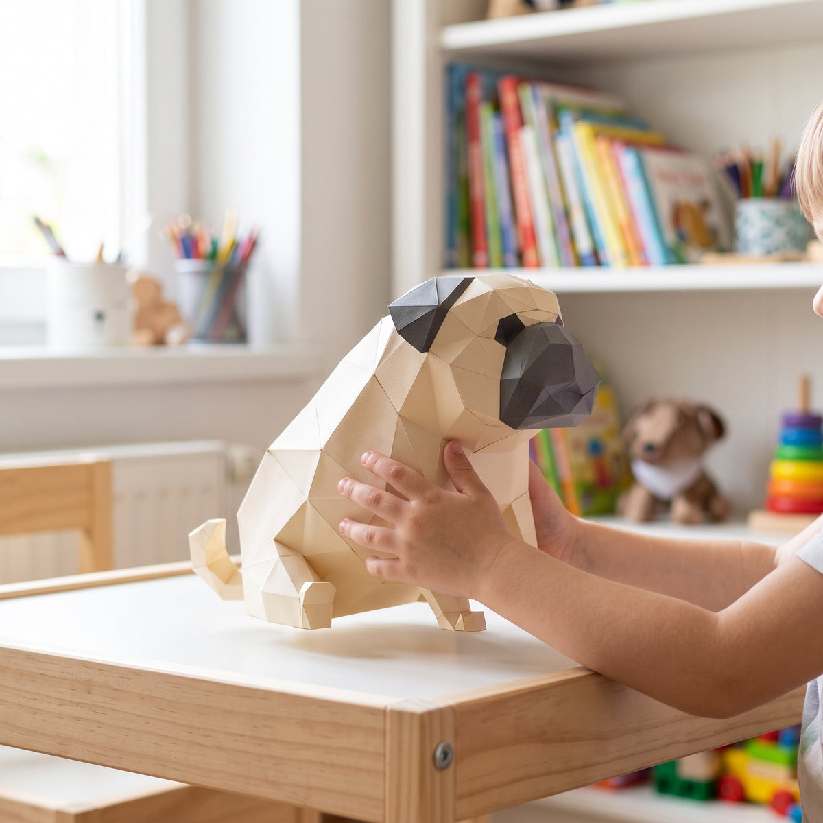 Paper Pug model in a child's hands
