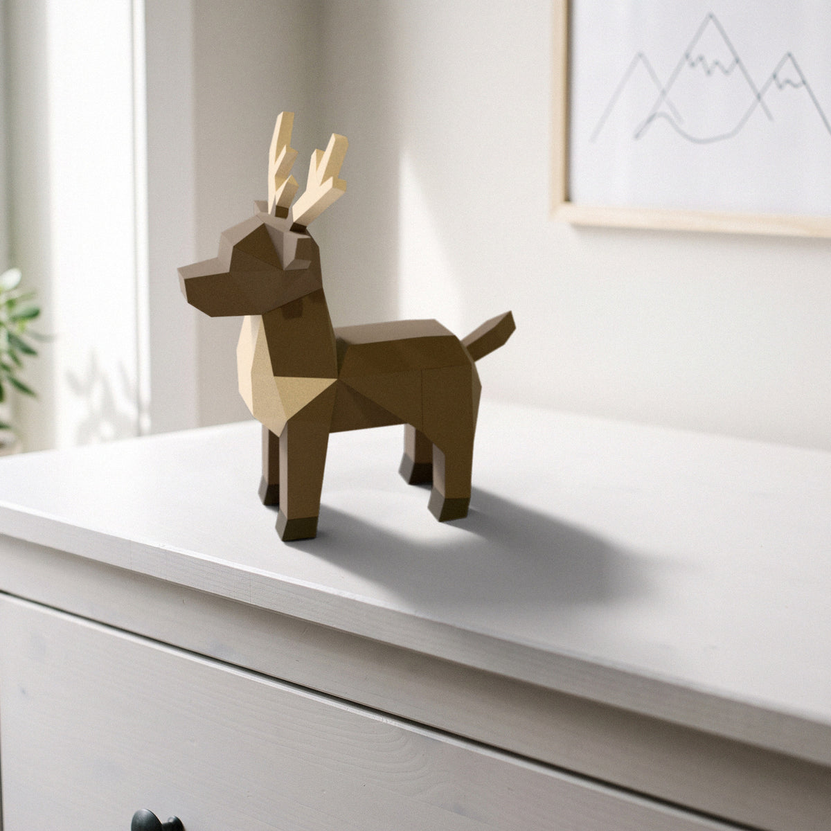 Paper Reindeer model on a dresser in a kids' room