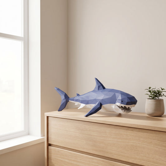 Paper Shark model on a table by the window