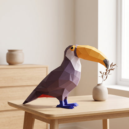 Paper Toucan model on a table by the window
