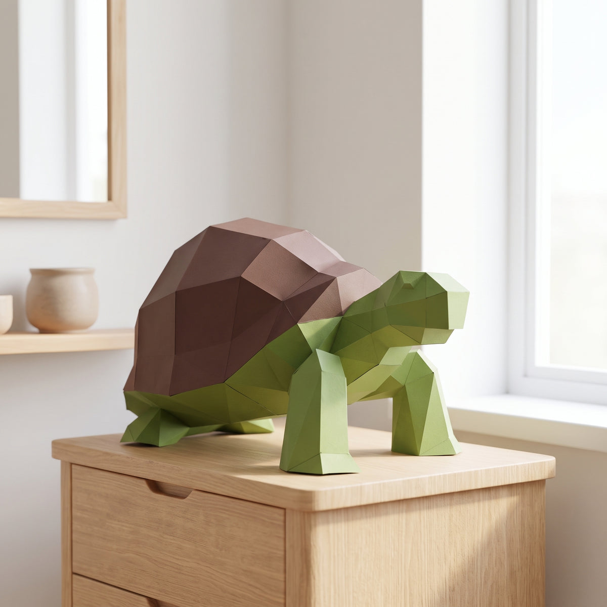 Paper Turtle model on a table by the window